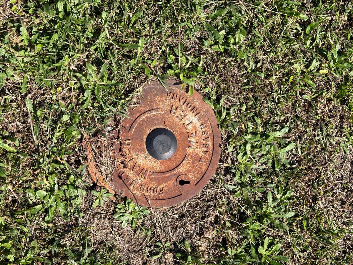 Existing water meter lid documented during an as-built site capture.